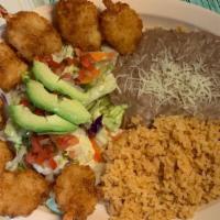 Camarones Empanizados · Breaded shrimp, deep fried to perfection. Served with rice, beans, and handmade corn tortill...