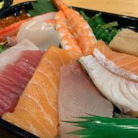 Chirashi  · Traditional Japanese style, assorted sliced fish, over sushi rice.