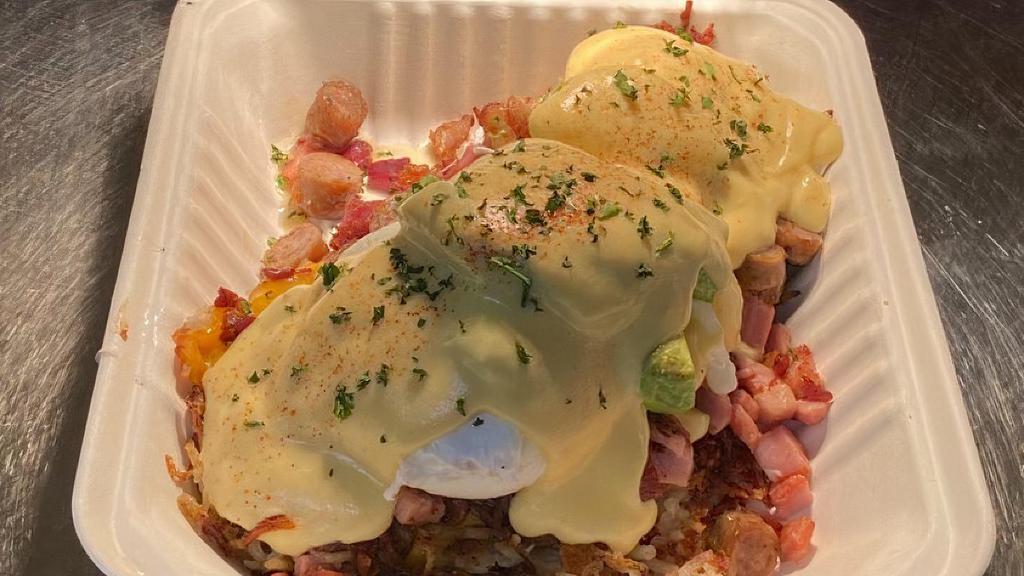 Hash Brown Benedict · Crispy hash browns topped with ham, bacon, sausage, cheddar cheese, avocado, two poached eggs and hollandaise sauce.