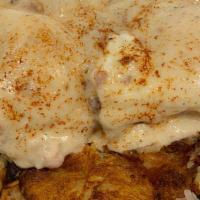 Chicken Fried Steak Benedict · Chicken fried steak and two poached eggs over a warm buttermilk biscuit topped with country ...