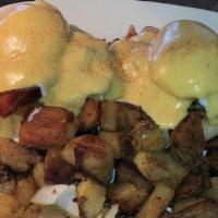 Turkey Bacon Benedict · Turkey bacon spinach avocado and two poached eggs over a toasted English muffin topped with ...