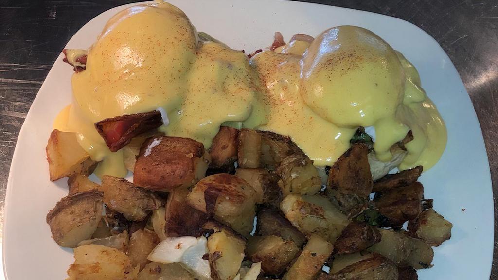 Turkey Bacon Benedict · Turkey bacon spinach avocado and two poached eggs over a toasted English muffin topped with hollandaise sauce.