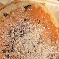 Chocolate Chip Pancakes · Two Golden Buttermilk Pancakes Stuffed with Chocolate chips. Topped with Powder Sugar Served...