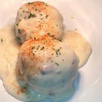 Biscuits 'n Gravy · 2 Homemade biscuits cut in half to make 4 and topped with our home made Country Gravy. A Din...