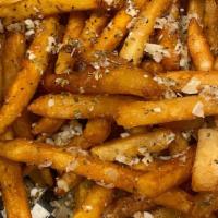 Garlic Fries · Gilroy Garlic on top of our famous battered french fries. Seasoned and spiced to perfection.