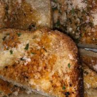 Garlic Bread · 4 pieces of Our Homemade Garlic Bread. Seasoned, Spiced, and topped with parmesan cheese and...