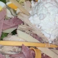 Chef's Salad · Mixed greens, turkey, and ham cheese, potato salad, hard boiled egg and cottage cheese.