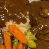 Open Roast Beef · Two Slices of white bread topped hot juicy roast beef and brown gravy. Served with vegetable...