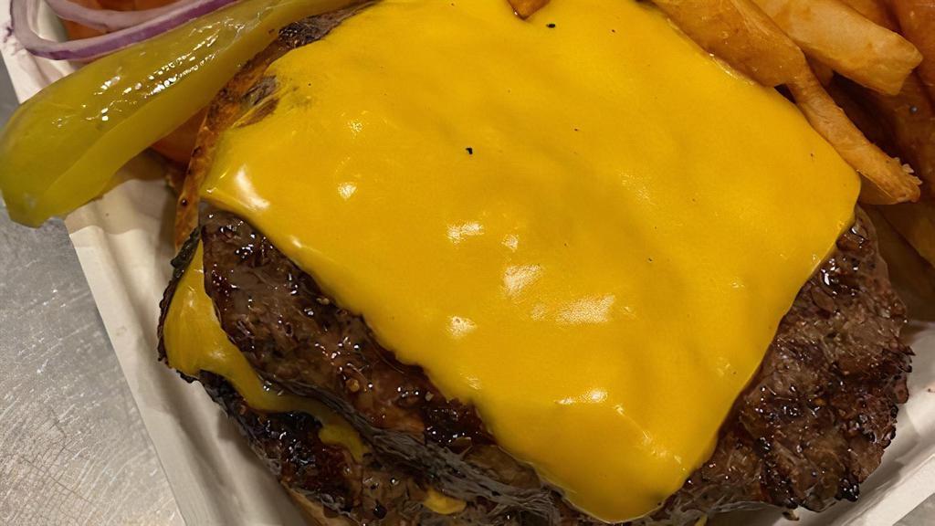 Double Cheeseburger · One pound of 100% certified angus beef. Double patty, double cheese.