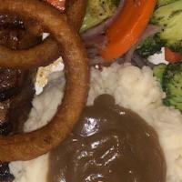 Tri-Tip Steak · Topped with sautéed mushrooms or onion rings served with sautéed vegetables and potato.