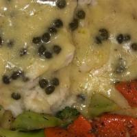 Chicken Piccata · Tender chicken breast sautéed in lemon butter sauce with capers, served with sautéed vegetab...