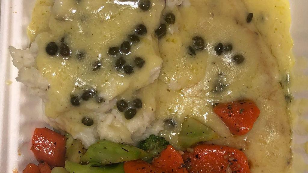 Chicken Piccata · Tender chicken breast sautéed in lemon butter sauce with capers, served with sautéed vegetables and potato.
