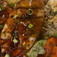 Chicken Teriyaki · Broiled chicken breast over a bed of rice, topped with a teriyaki glaze. Served with sautéed...