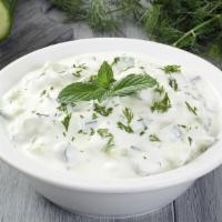 Tzatziki Salad · Cucumber yogurt mixed with mint, garlic and lemon