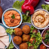 Veggie combo plate  · Hummus, Baba Ganoush, Dolma, Falafel, Tabbouleh.