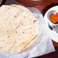 Papadum · Delicate and crispy sundries lentil wafers.