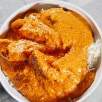 Butter Chicken (Chicken Makhani) · Marinated chicken cooked in tomato butter sauce and special spices.