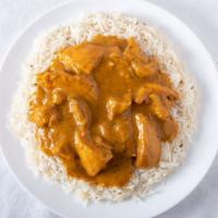 Mango Chicken · Tender chicken cooked with curry sauce, fresh mango and spices.