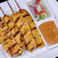 04 - SATAY CHICKEN · Skewered strips of chicken (4) marinated with curry, tamarind, lemongrass, and coconut milk....