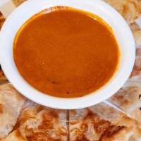 12 – ROTI · A crispy multilayer Thai pancake served with house curry dip