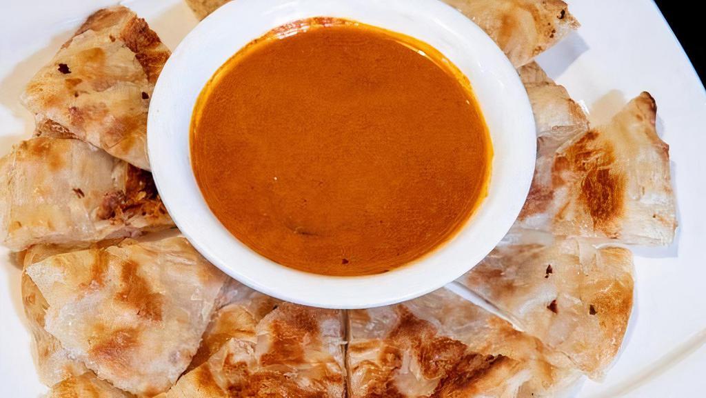 12 – ROTI · A crispy multilayer Thai pancake served with house curry dip