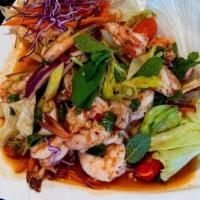 20 - SPICY SHRIMP OR SQUID SALAD · Extra jumbo shrimp or Squid mixed with green onion, fresh cilantro, carrot, fresh mint leave...