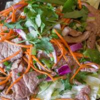 26 - BEEF SALAD · Sliced beef mixed with green onion, fresh mint leaves, diced red onion, fresh cilantro, carr...