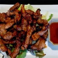 B2 - BBQ SLICED PORK · Barbecued boneless pork marinated in our special Thai honey sauce. Served with a house sweet...