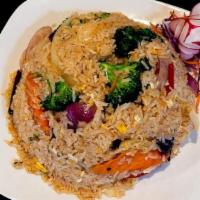 44 - VEGETARIAN FRIED RICE · Stir-fried rice with broccoli, zucchini, carrot, yellow onion, tomato, fried tofu, and green...