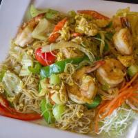 57 - KAREE STIR FRY · Rice vermicelli seasoned with curry powder and stir-fried with bean sprouts, bell pepper, ye...