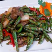 72 - PAD PRIK KHING · Choice of protein sautéed with green beans, Thai chili, bell pepper, minced garlic, yellow o...