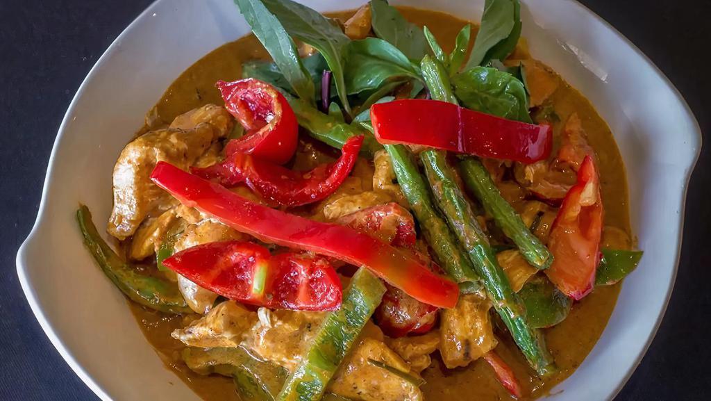63 - PANANG CURRY · Panang curry paste simmered with coconut milk, fresh basil leaves, green beans, bell pepper, potato, kaffir lime leaves, galangal, and lemongrass, with your choice of protein