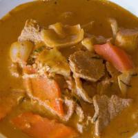 65 – MUSSAMAN CURRY · Massaman curry paste simmered with coconut milk, yellow onion, potato, carrot, kaffir lime l...