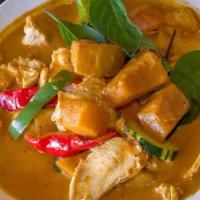 69 - PUMPKIN CURRY · Fresh pumpkin with red, yellow, or green curry paste simmered with coconut milk, bamboo shoo...