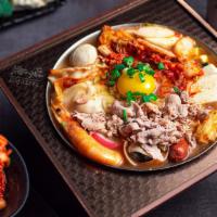 Kimchi Dumpling Hot Soup · Taiwanese cabbage, pork slices, kimchi, dumpling, vermicelli, mini sausage, shrimp, enoki mu...