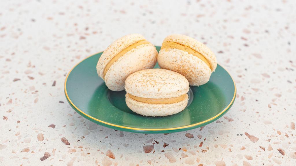 Churro Macaron · Our Churro Macaron is definitely a Fancy Flavors' favorite! Made with caramel cinnamon buttercream with a dollop of dulce de leche in the center all in between 2 macaron shells topped with cinnamon sugar. This will surely be one of your top flavors too!