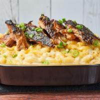 BBQ Pulled Pork Mac by Mac 'n Cue · By Mac 'n Cue by International Smoke. Topped with curry cornbread crumble and scallions. Con...