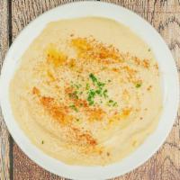 Hummus · Dish made from cooked, mashed chickpeas blended with tahini, lemon juice, and garlic.
