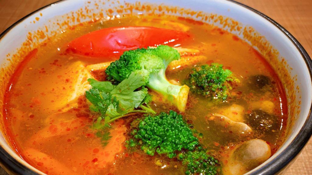 Tom Yum · Hot and sour soup with mushrooms, tomatoes, lemongrass, galanga from the ginger family, and lime juice. Add chicken, tofu, shrimp, veggie for an additional charge.