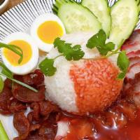 Kao Moo Dang · Roasted pork, pork sausage and boiled egg served with rice and homemade red gravy sauce.
