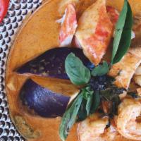 Red Curry · Medium spicy curry cooked with coconut milk, sweet basil, eggplant, string beans, bell peppe...