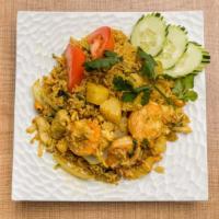 Pineapple Fried Rice · Fried rice with chicken, shrimp, pineapple, onions, tomatoes, cashew nuts, crab paste, and c...