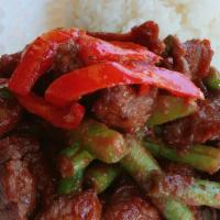 Pad Prik Khing · Choice of meat sauteed with spicy chili paste and string beans. Add rice, pork, beef, veggie...
