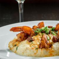 Shrimp 'N' Grits (Gf) · Blackened shrimp, red and green bell peppers, chorizo, served over a bed of our cheesy grits.