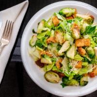 Caesar & Brussel Sprout Salad · Crisp romaine lettuce, toasted brussel sprouts, Parmesan cheese, croutons and creamy caesar ...