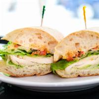 Tuscan Chicken · Natural chicken breast, avocado, melted jack cheese, lettuce, roasted tuscan tomato relish, ...