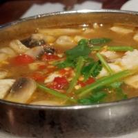 Tom Yum (Chicken) · sour soup with mushrooms, lemongrass, galangal, lime juice, chili paste, kaffir leaves, and ...