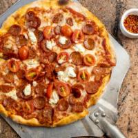 U-Pizza Salsicca · Mozzarella, goat cheese, tomato sauce, spicy Calabrese sausage, cherry tomatoes