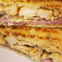 Grilled Chicken Breast Panini · Lettuce, tomatoes, red onions, mayo, mustard, pesto, olive oil, grilled chicken, and cheddar...