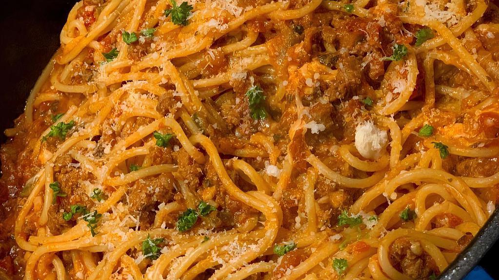 Spaghetti Bolognese · Marinara sauce, fresh garlic oregano, parmesan cheese. Add meatball for an additional charge.